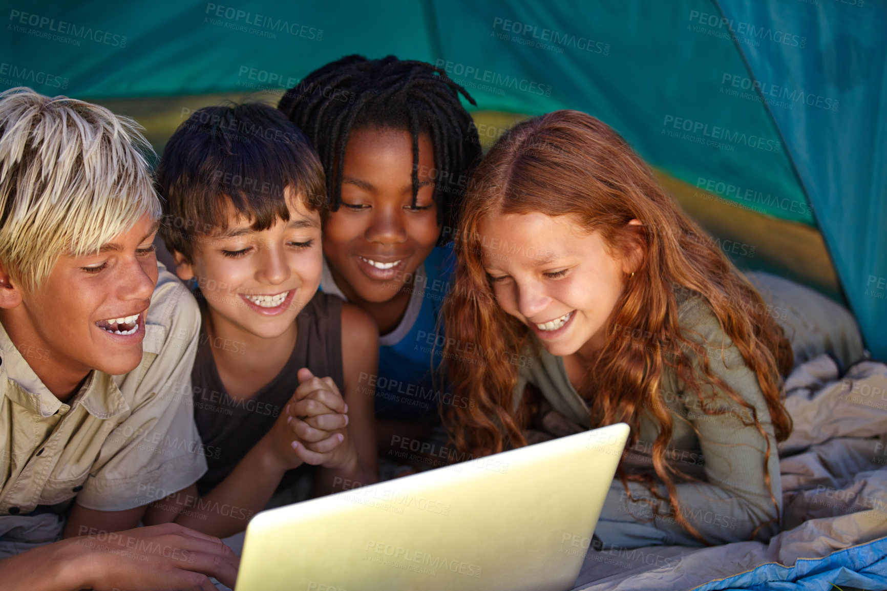 Buy stock photo Laptop, happy and children in tent for camp watching movie, film or show online together. Smile, technology and young kids bonding, relax and streaming video on internet with laptop on weekend trip.