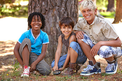 Buy stock photo Shot of young boys enjoying the outdoors while camping