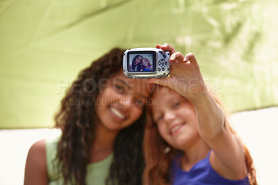 Buy stock photo Happy girl, friends and camera with selfie in tent for memory, camping or photography together. Young female person, child or kids with smile for picture, photo or social media in relax or friendship