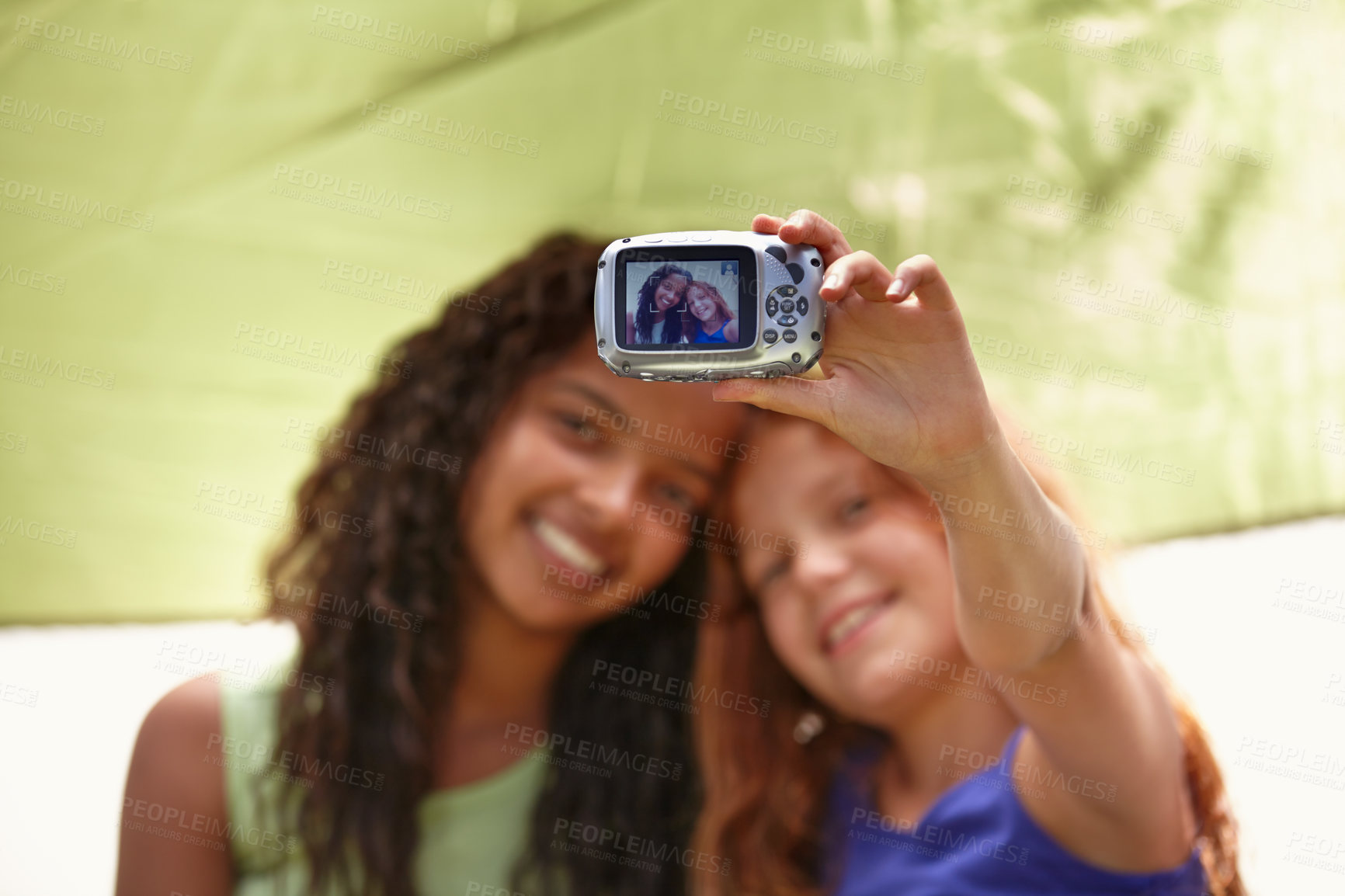 Buy stock photo Happy girl, friends and camera with selfie in tent for memory, camping or photography together. Young female person, child or kids with smile for picture, photo or social media in relax or friendship