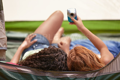 Buy stock photo Camping, tent and friends with camera for selfie, memory and relax together on vacation. Back, head and children capture photography with tech on holiday, adventure or casual moment outdoor in summer