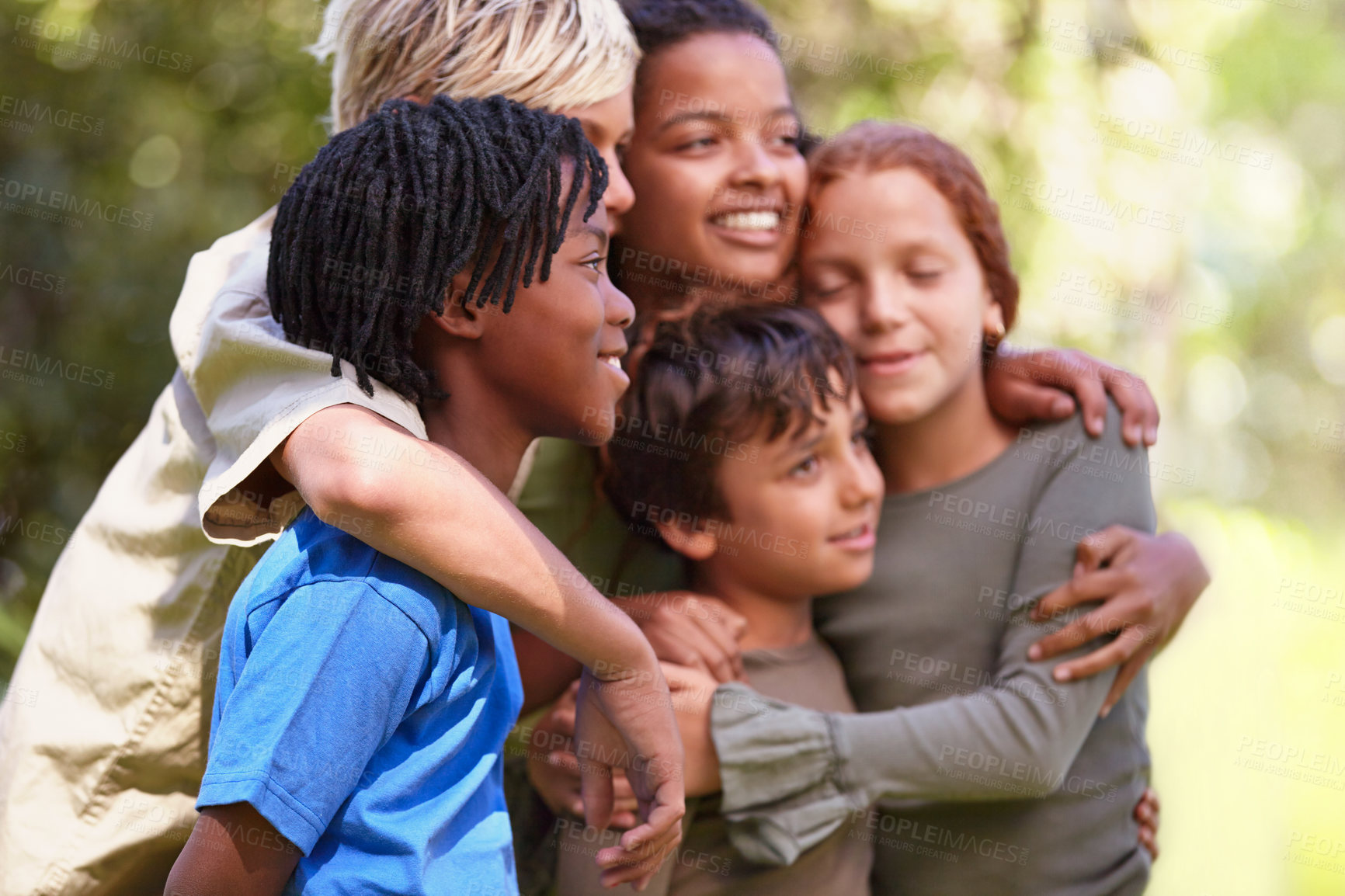 Buy stock photo Children, together and hug with diversity in nature adventure, support and bonding on summer camp. Kids, embrace with smile for love, international and friendship in forest or woods on vacation.