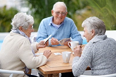 Buy stock photo Poker, smile and senior group with retirement, outdoor and cheerful together with joy, relax and playful. Elderly people, old man and mature women outside, card games and chilling with social bonding