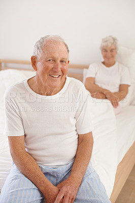 Buy stock photo Senior man, couple and portrait in bed, smile and relaxing together in retirement at home. Elderly people, bedroom and happy in marriage or relationship, love and bonding for romance on weekend