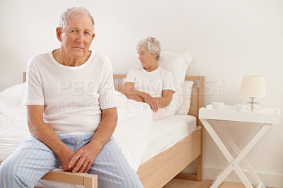 Buy stock photo Senior, couple and stress in bedroom with conflict, ignore and crisis in marriage for mental health and retirement. Elderly, woman or man with fight, sad and divorce on bed in home with disagreement 
