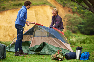Buy stock photo Camping, men and happy with tent for assemble on grass in nature with equipment for holiday, relax and vacation. People, getting ready and campsite in woods for adventure, travel or bonding in forest