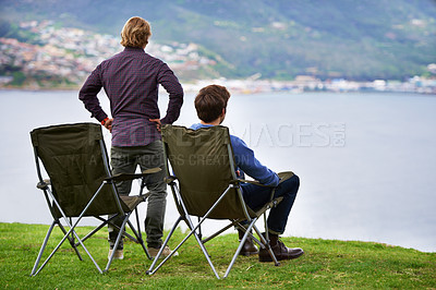 Buy stock photo Camping, chair and people relax at lake with landscape in countryside, nature or calm vacation. Summer, holiday and back of friends sitting on grass at river with peace in environment together