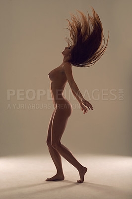 Buy stock photo Full body shot of a young woman posing nude in the studio