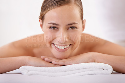 Buy stock photo Spa, massage and portrait of woman on bed with smile for luxury, treatment and pamper with peace in hotel. Female person, happy and body care at resort for wellness, enjoyment and rest on vacation