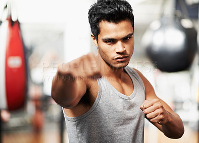 Buy stock photo Man, portrait and training with confidence, boxing and fists ready to punch in match for health and exercise. Male person, workout and focus in gym, mma and boxer for sports and combat for defence