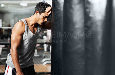 Buy stock photo Gym, fitness and tired with man and punching bag, low energy and performance mistake or disaster. Sports, fatigue or boxer exhausted by intense body workout, challenge or fighting practice burnout