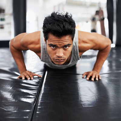 Buy stock photo Mexican man, strong and training for fitness, sport and health for boxer on mat with pushups. Male person, wellness and exercise for workout, athlete and cardio strength for commitment in boxing gym