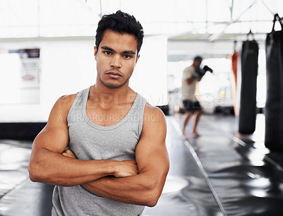 Buy stock photo Exercise, training and portrait of man in gym for sport, practice or wellness for health. Personal trainer, face and serious expression with arms crossed for confidence, fight skill or development