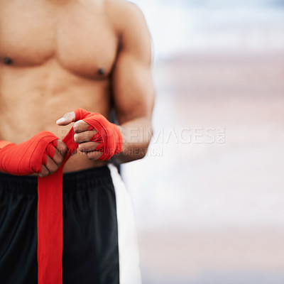 Buy stock photo Man, hand and wrap for mma, protection and strength at fitness and workout studio with mockup. Person with strap, fist or fingers to bandage and protect for exercise, training or competitive fighting