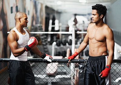 Buy stock photo Fitness, talking and fighter in gym with coach for training, self defense or combat training. Exercise, sports or boxing with shirtless man and personal trainer in preparation for competition
