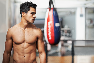 Buy stock photo Boxing, training and man in gym for exercise, practice and fitness for health. Personal trainer, serious expression and thinking with confidence for workout, planning and vision with shirtless body