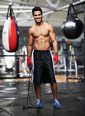 Buy stock photo Man, portrait and equipment in gym for boxing, training and keeping fit for competition. Male person, mma fighter and exercise in fitness centre for wellness, health and maintain strength for match