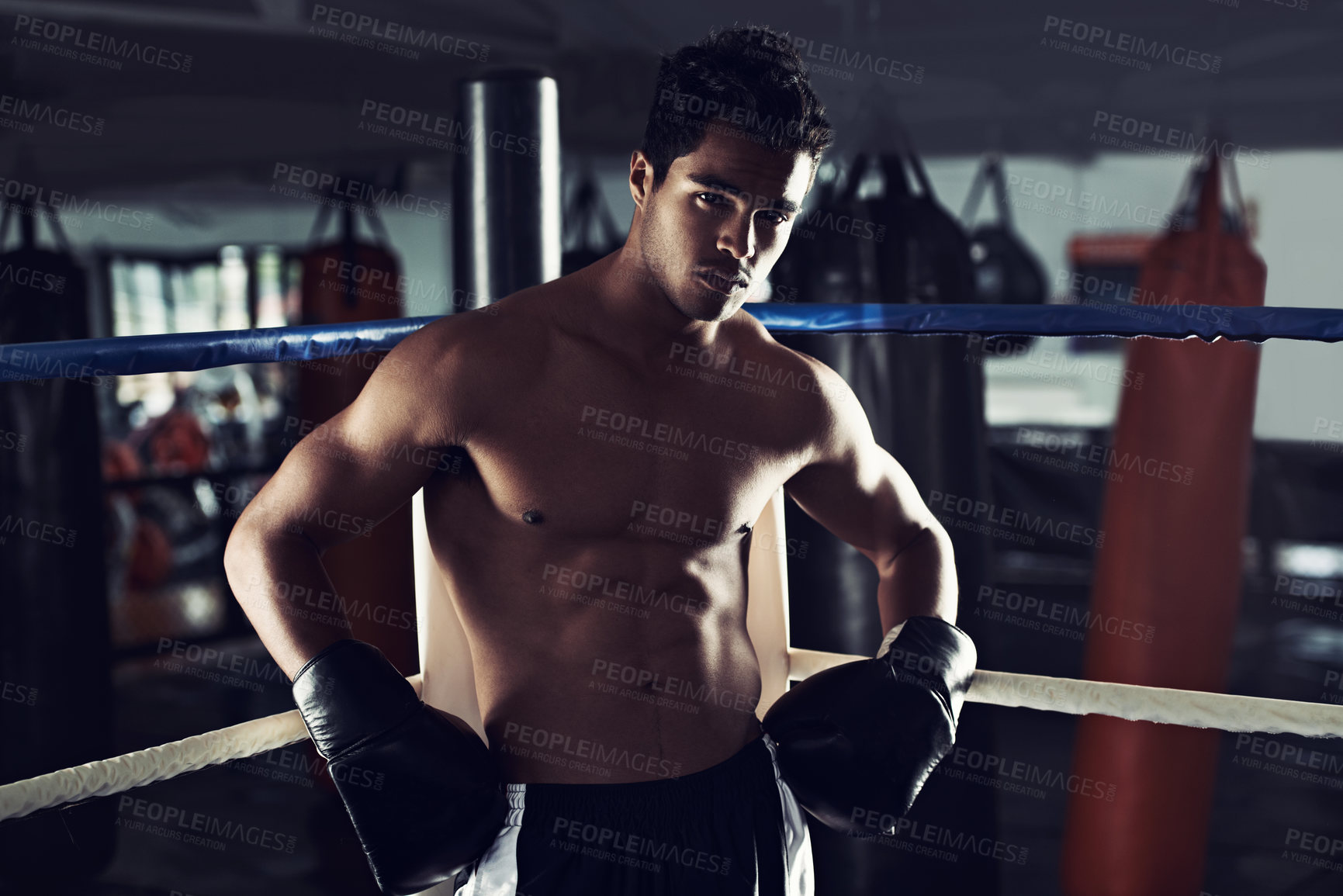 Buy stock photo Male person, boxing and sport in gym, portrait and fitness for exercise and wellness in training for strong fight. Man, athlete and boxer in workout, challenge and shirtless ready to punch for mma