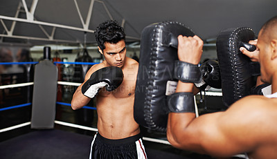 Buy stock photo Boxer, man and coach in boxing ring for training, workout and punching bag for performance with fight and fitness. Professional, athlete and exercise for competition, match or sport with healthy body