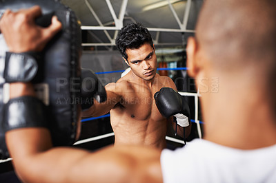 Buy stock photo Boxer, man and coach in boxing ring with punching bag for training, workout and performance with fight or fitness. Professional, athlete and exercise for competition, match or sport with healthy body