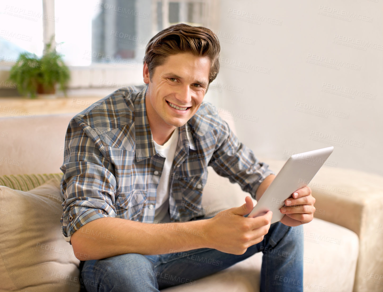 Buy stock photo Tablet, happy and portrait of man on sofa in home for social media, networking and browse website. Relax, smile and person with digital tech for internet, connection and streaming in living room