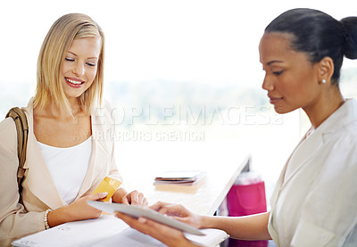 Buy stock photo Hotel payment, woman and a receptionist with a tablet for booking, service and credit card for reservation. Happy, checkin and worker with technology for a customer to pay for accommodation services