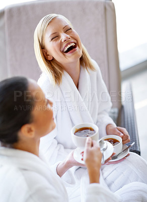 Buy stock photo Laughing, talking and friends drinking tea at spa before luxury, beauty and self care treatment. Happy, funny and women bonding, in conversation and enjoying warm beverage together at wellness salon.