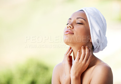 Buy stock photo Woman, relax and spa with towel outdoor with calm and peace from beauty and skincare treatment. Mockup, hotel and wellness with skin, glow and touch at a resort with facial and cosmetics with care