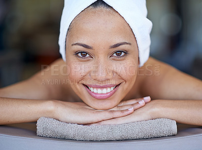 Buy stock photo Spa, woman and portrait on massage bed with smile for wellness, zen and beauty treatment for body care. Person, relax and physical therapy at resort, salon table and luxury on holiday or vacation