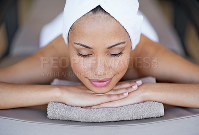 Buy stock photo Luxury, woman and relax on massage bed with smile for wellness, zen and beauty treatment for body care. Person, stress relief and peaceful at resort, salon table and spa on holiday or vacation