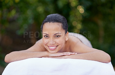 Buy stock photo Spa, woman and portrait on massage bed with smile for wellness, zen and beauty treatment for body care. Person, relax and physical therapy at resort, salon table and luxury on holiday or vacation