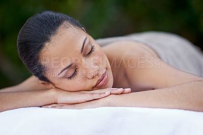 Buy stock photo Sleep, massage and a woman on a spa bed for stress relief, luxury relaxation and wellbeing in nature. Relax, calm and a young lady sleeping after a skin treatment, pampering and wellness in a garden