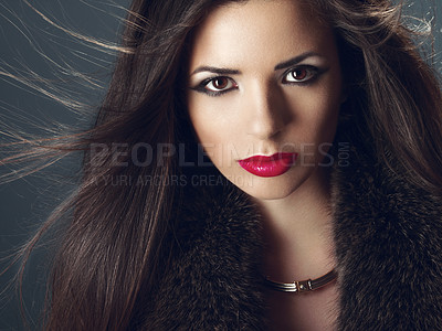 Buy stock photo Studio portrait of a fashion model with wind swept hair  
