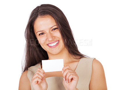 Buy stock photo A young businesswoman smiling and holding a business card while isolated on white