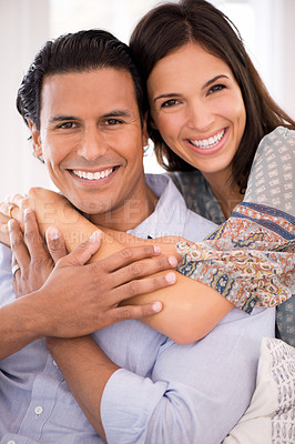Buy stock photo Smile, hug and portrait of couple in home for weekend bonding, romance and connection on sofa. Love, support and trust in marriage, man and happy woman on couch with embrace, wellness and smile.