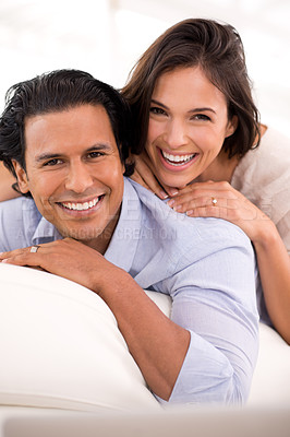 Buy stock photo Relax, laugh and portrait of happy couple on sofa for weekend bonding, romance and connection in home. Love, support and trust in marriage, man and woman on couch with embrace, wellness and smile.
