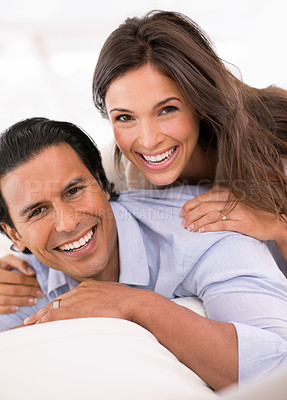 Buy stock photo Relax, bonding and portrait of happy couple on sofa for weekend romance, hug and connection in home. Love, support and trust in marriage, man and woman on couch with embrace, wellness and smile.