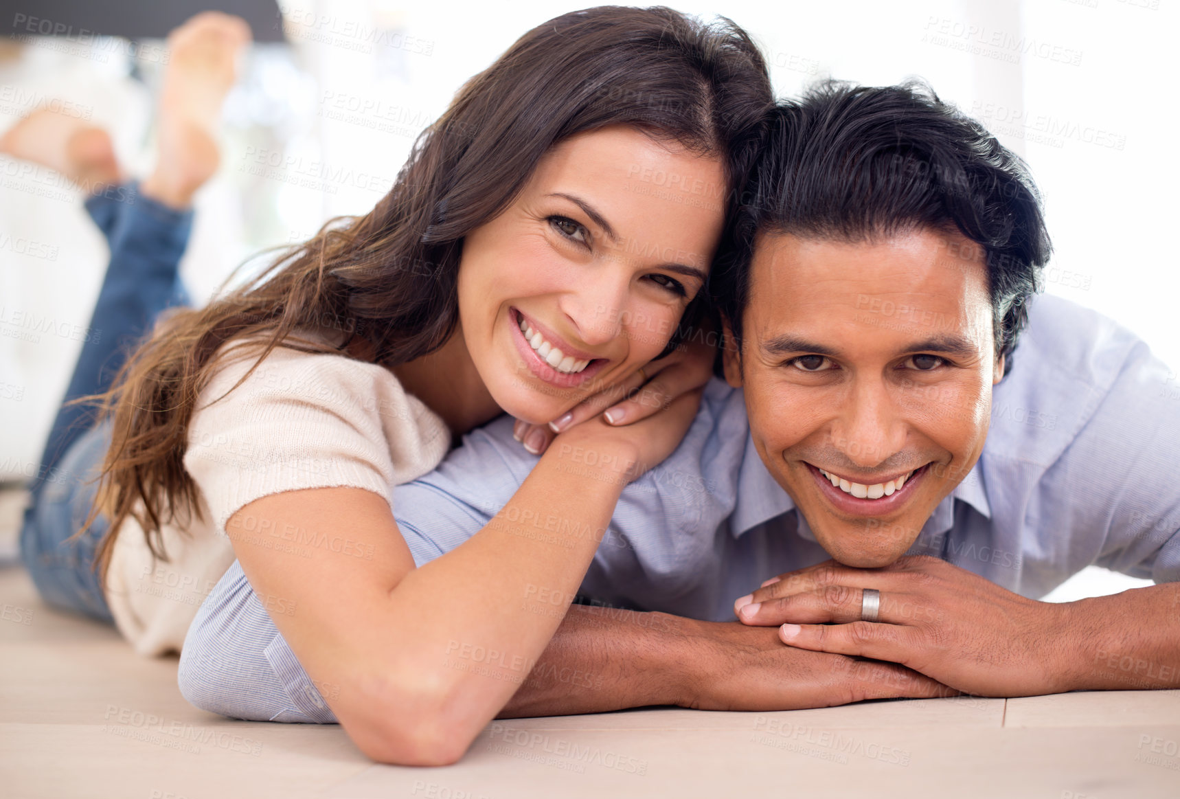 Buy stock photo Portrait, couple and smile for rest and relaxation, romance and bonding together at home after work. Happy, husband and wife with hug, touch and love for positive, relationship and commitment
