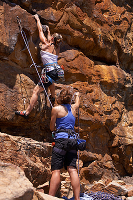 Buy stock photo Rock climbing, cardio and friends with route planning and pointing for adventure and outdoor exercise. Mountain, sport and training in nature with people on a peak for a workout together for fitness