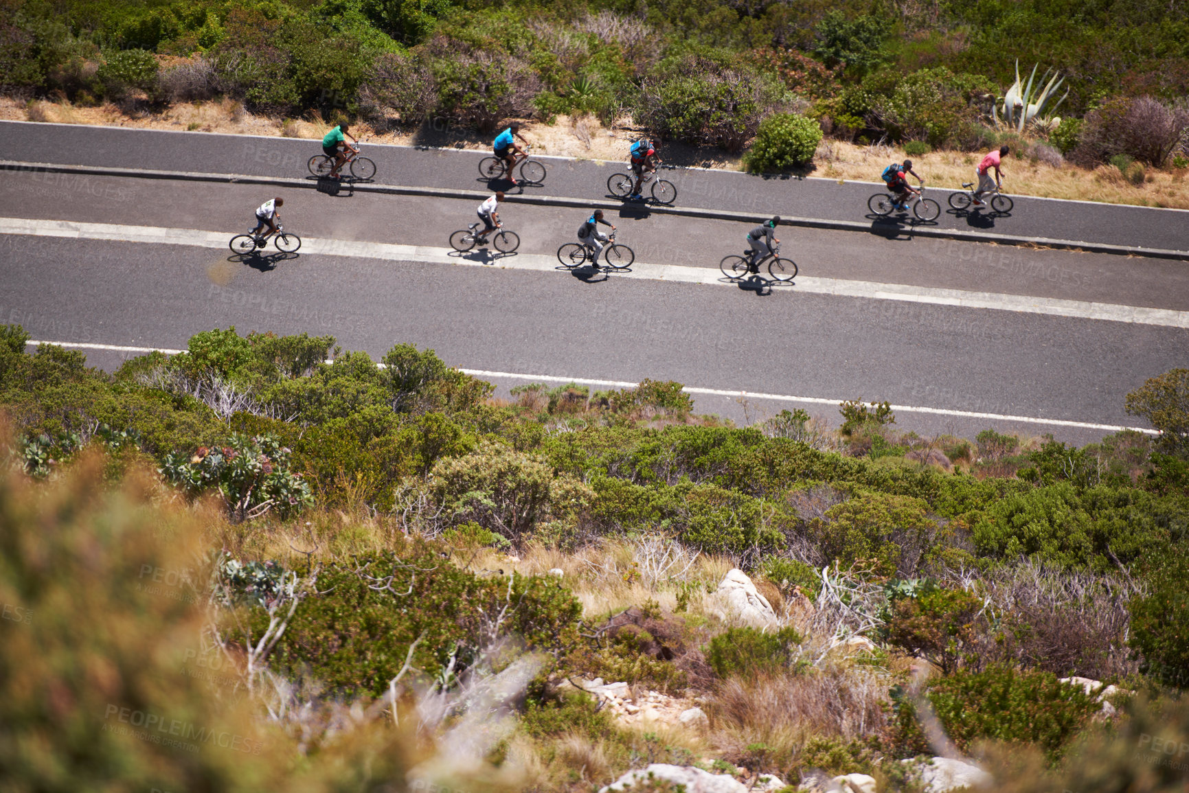 Buy stock photo Group of friends, cycling and road for exercise, training and fitness with bonding together outside. Aerial, people and bicycles on highway for health, workout and outdoor activity in Portugal