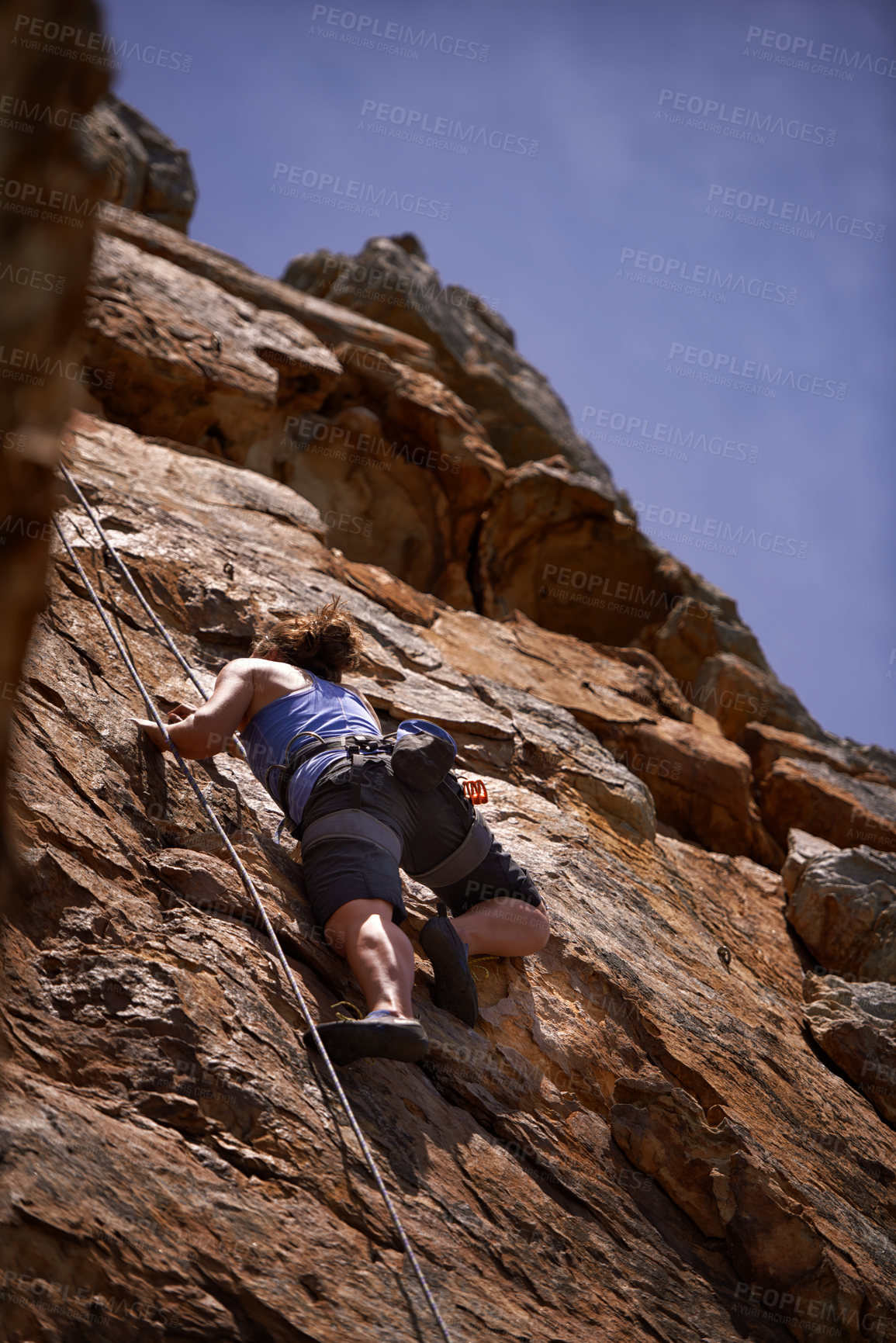 Buy stock photo Mountain, fitness and woman rock climbing in nature for wellness, freedom or training. Balance, cliff or below lady athlete with adrenaline, sport or energy for workout, challenge or body performance