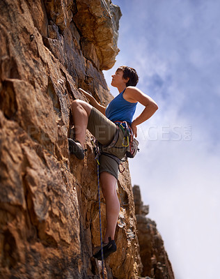 Buy stock photo Rock climbing, woman and fitness with adventure, rope and gear in nature on a mountain. Cliff, hiking and sport with athlete challenge and thinking for workout, exercise and climber training outdoor