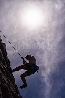 Buy stock photo Mountain, rock climbing and fitness woman in nature for wellness, freedom or training. Balance, cliff or below lady athlete with adrenaline, sport or energy for workout, challenge or body performance