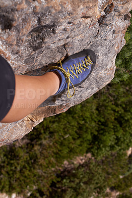 Buy stock photo Closeup, leg or shoe for rock climbing, fitness or nature for health, adventure or outdoor activity. Mountain climber, cliff and trees for healthy exercise, sports and leisure in Puerto Rico