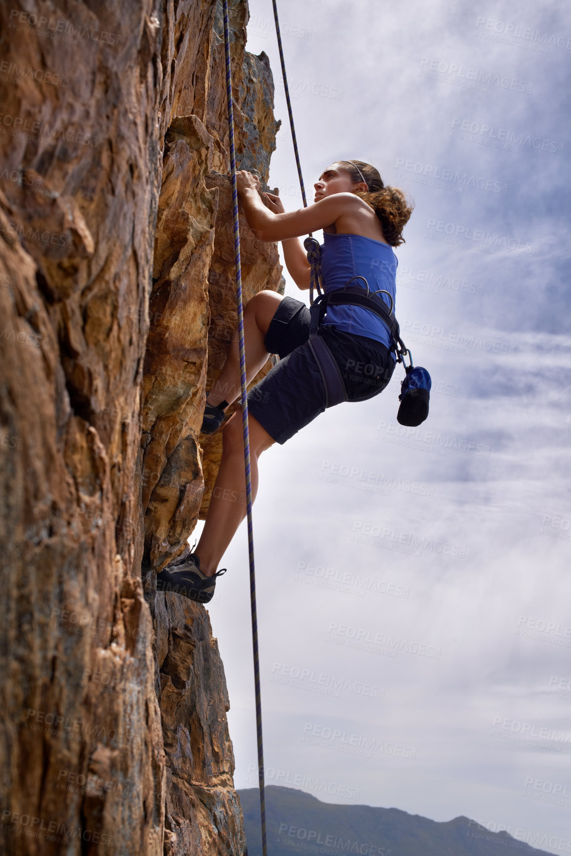 Buy stock photo Woman, mountain and rock climbing for hiking in outdoors, challenge and rope for training. Female person, cliff and extreme sport for exercise or workout, adventure and support to explore in nature