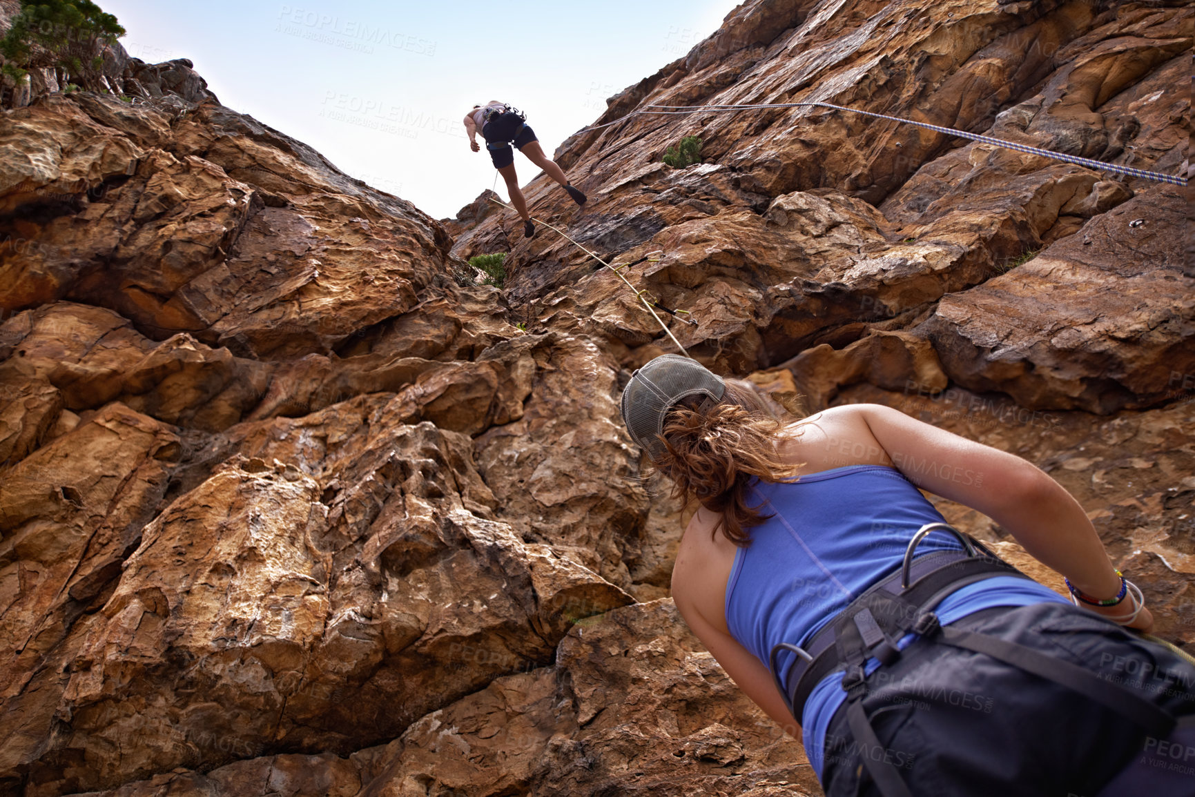 Buy stock photo Friends, rope and mountain for rock climbing, safety and adventure on weekend getaway with bonding. Partner with people, outdoor and gear for protection with sports, fitness and exercise in nature