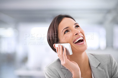 Buy stock photo Happy, cheerful businesswoman smiling and laughing on mobile phone call in modern office. Corporate executive female worker enjoying a funny and positive conversation on her digital cellphone