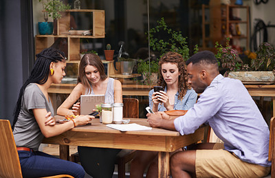 Buy stock photo Technology, diversity and friends in restaurant together for social gathering with phone, tablet and networking. Coffee shop, brunch and people relax at sidewalk cafe with text, email or digital app.