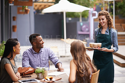 Buy stock photo Waitress, drinks and customers at coffee shop for hospitality, friendly and service in New York. Smile, barista and hot beverage for people at cafe for bonding, rest and relaxation after work in city