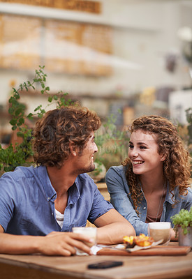 Buy stock photo Young people enjoying a beverage at a sidewalk cafe
